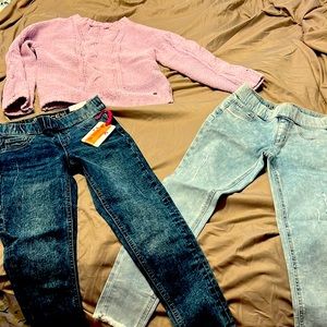 Two pairs of pants and one sweater. $20